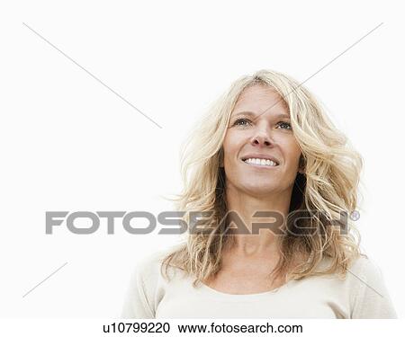 Smiling woman looking away from camera View Large Photo Image Stock Image - Smiling woman looking away from camera. Fotosearch