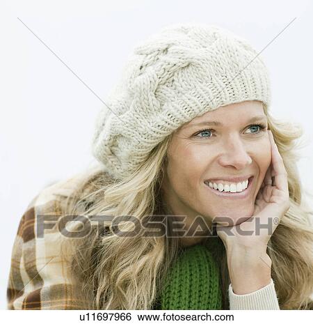 Smiling woman looking away from camera View Large Photo Image Stock Photograph - Smiling woman looking away from camera. Fotosearch