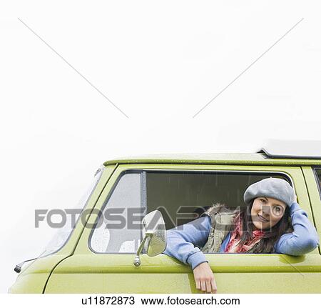 Smiling woman looking of camper van View Large Photo Image Stock Image - Smiling woman looking of camper van. Fotosearch