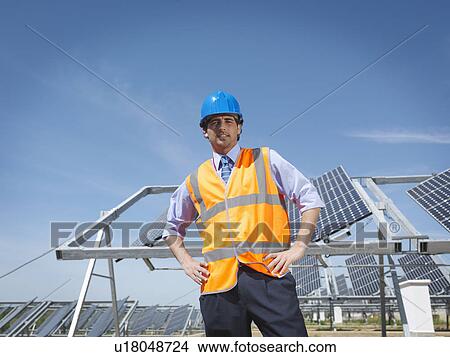 Picture - Spanish solar power station and engineer. Fotosearch