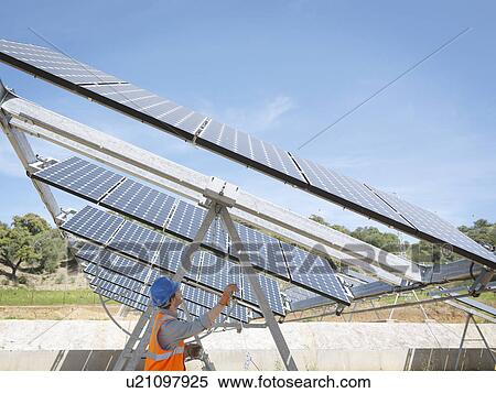 Spanish solar power station with worker View Large Photo Image Stock Photography - Spanish solar power station with worker. Fotosearch