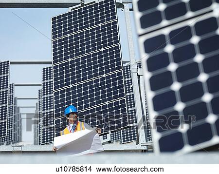 Spanish solar power station with workers View Large Photo Image Picture - Spanish solar power station with workers. Fotosearch
