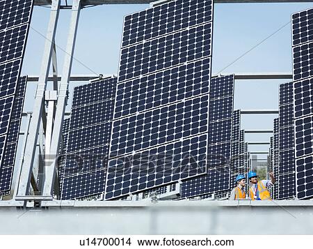 Spanish solar power station with workers View Large Photo Image Picture - Spanish solar power station with workers. Fotosearch