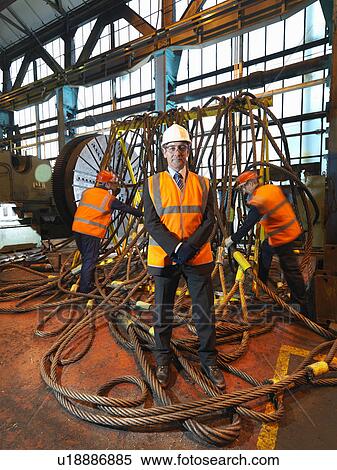 Stock Photography - Steel Engineers With Lifting Gear. Fotosearch