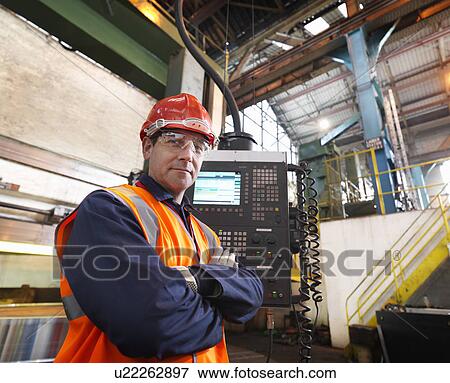 Steel Worker With Control Panel In Plant View Large Photo Image Stock Photo - Steel Worker With Control Panel In Plant. Fotosearch