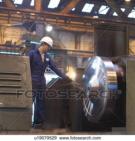 Stock Photo - Steel Worker With Lathe. Fotosearch