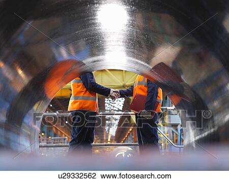 Steel Workers Shaking Hands View Large Photo Image Stock Image - Steel Workers Shaking Hands. Fotosearch