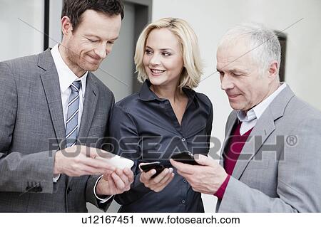 Team comparing data View Large Photo Image Stock Image - Team comparing data. Fotosearch