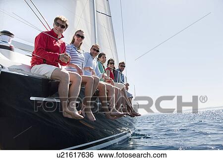 Stock Photograph - Team of six on yacht. Fotosearch