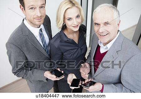Team with Handhelds View Large Photo Image Stock Photo - Team with Handhelds. Fotosearch