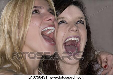 Teen friends laugh View Large Photo Image Stock Image - Teen friends laugh. Fotosearch