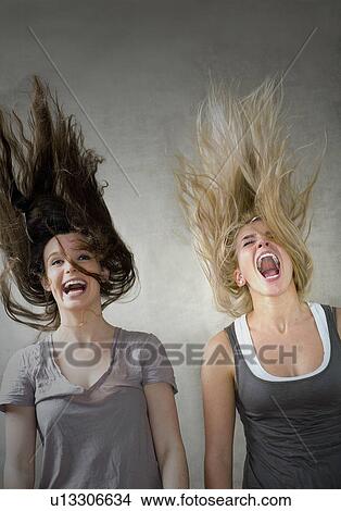 Picture - Teen girls laughing together. Fotosearch