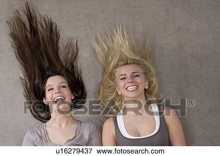 Teen girls laughing together View Large Photo Image Stock Photo - Teen girls laughing together. Fotosearch