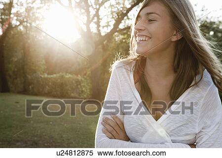 Stock Photography - Teen in a garden. Fotosearch