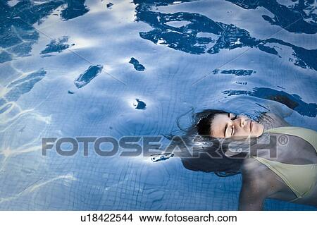 Teen in a pool View Large Photo Image Picture - Teen in a pool. Fotosearch