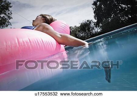 Stock Image - Teen in a pool. Fotosearch