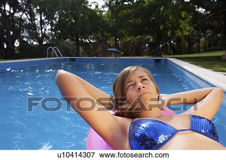 Stock Photo - Teen in a pool. Fotosearch