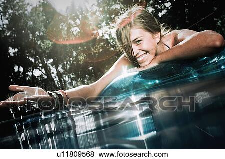 Stock Photo - Teen in a pool. Fotosearch
