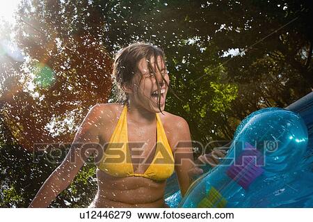 Stock Photo - Teen in a pool. Fotosearch