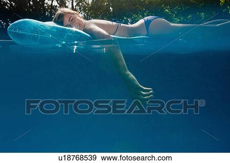 Teen in a pool View Large Photo Image Stock Photo - Teen in a pool. Fotosearch