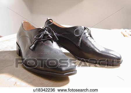The result of works effort on shoes View Large Photo Image Stock Photograph - The result of works effort on shoes. Fotosearch