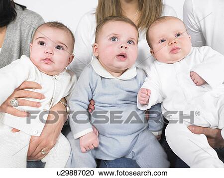 Three babies with mothers View Large Photo Image Stock Image - Three babies with mothers. Fotosearch