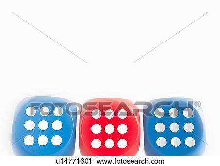 Stock Image - Three dice each showing nine. Fotosearch