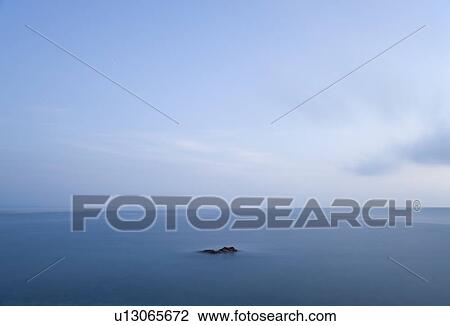 Stock Image - Tuscan sea at dawn. Fotosearch
