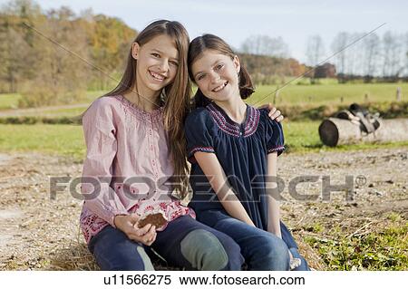 Two girls laughing View Large Photo Image Stock Photography - Two girls laughing. Fotosearch