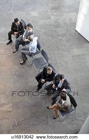 Two groups of business people discussing View Large Photo Image Stock Image - Two groups of business people discussing. Fotosearch