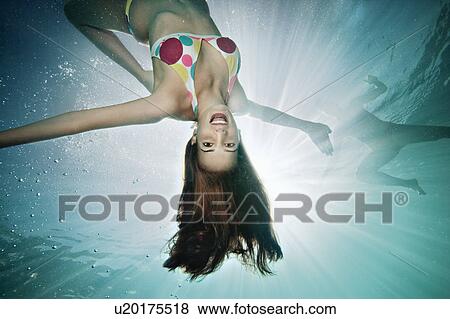 Underwater portrait of female swimmer View Large Photo Image Stock Photo - Underwater portrait of female swimmer. Fotosearch