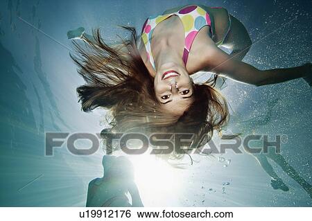 Underwater Portrait of female swimmer View Large Photo Image Stock Photograph - Underwater Portrait of female swimmer. Fotosearch