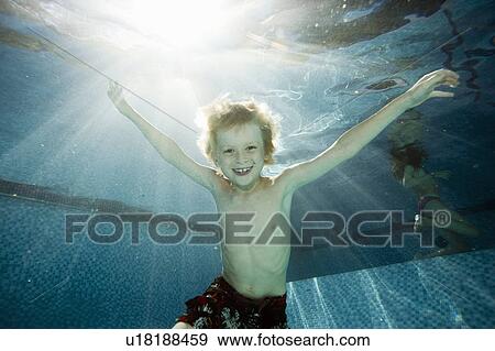 Underwater portrait of young boy age 8 View Large Photo Image Stock Photo - Underwater portrait of young boy age 8. Fotosearch