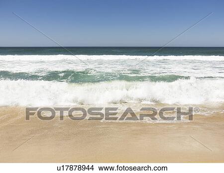 Waves breaking onto beach View Large Photo Image Picture - Waves breaking onto beach. Fotosearch