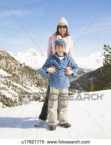 Woman and boy smiling in mountain snow View Large Photo Image Stock Photography - Woman and boy smiling in mountain snow. Fotosearch