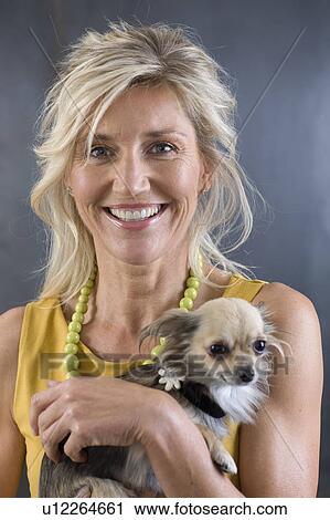 Stock Image - Woman and her dog. Fotosearch
