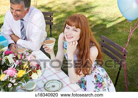 woman and mature man sit at table. View Large Photo Image Stock Image - woman and mature man sit at table.. Fotosearch