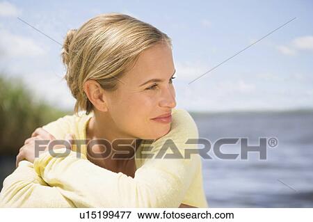 Woman at a lake View Large Photo Image Stock Photo - Woman at a lake. Fotosearch