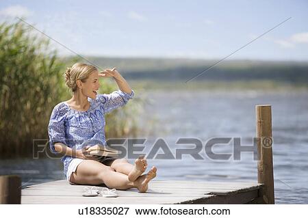 Woman at a lake View Large Photo Image Stock Photo - Woman at a lake. Fotosearch