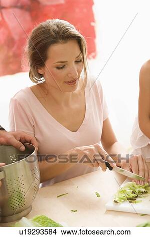 Woman cooking View Large Photo Image Picture - Woman cooking. Fotosearch