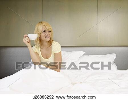Stock Image - Woman drinking coffee. Fotosearch