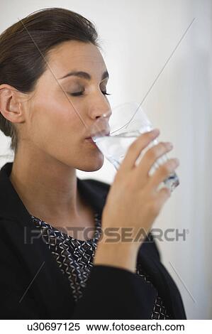 Stock Photography -  woman drinking milk. Fotosearch