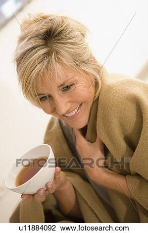 Stock Image - Woman drinking tea. Fotosearch