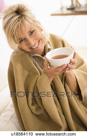 Woman drinking tea View Large Photo Image Stock Image - Woman drinking tea. Fotosearch