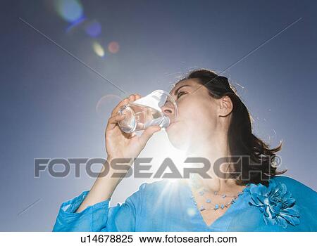 Woman drinking water View Large Photo Image Stock Photography - Woman drinking water. Fotosearch