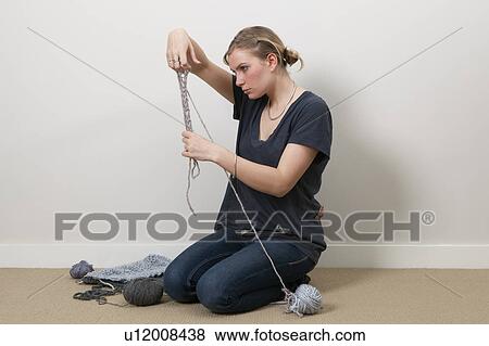Stock Photo - Woman finger knitting. Fotosearch