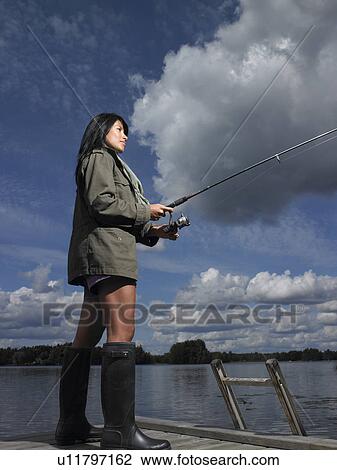 Stock Image - Woman fishing. Fotosearch