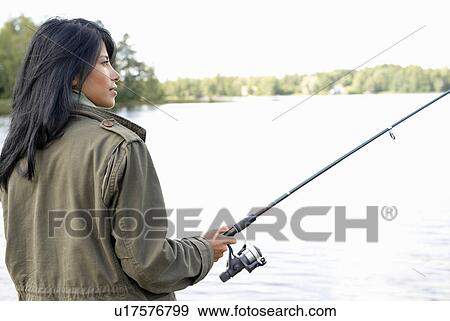 Woman fishing View Large Photo Image Stock Photo - Woman fishing. Fotosearch