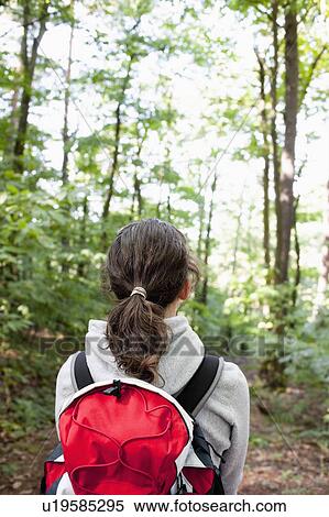 Woman hiking in woods View Large Photo Image Stock Photography - Woman hiking in woods. Fotosearch