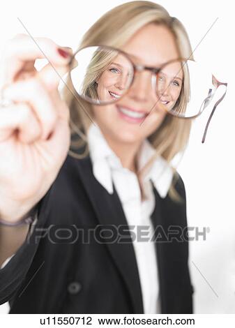 Woman holding glasses in front of her View Large Photo Image Stock Image - Woman holding glasses in front of her. Fotosearch